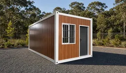 EX20Z folding site container standing open on a gravel pad, timber grain end wall, white corner posts, a barred window and a dark entry door