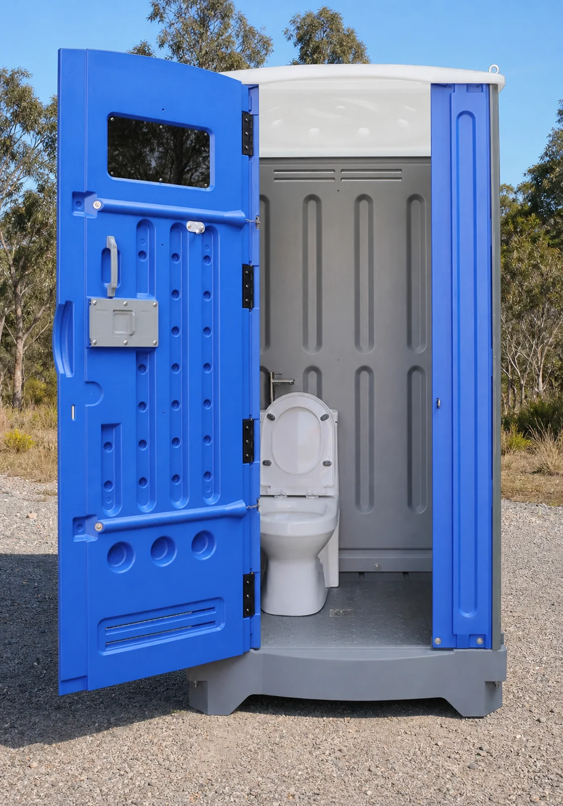 Blue and grey plastic toilet cubicle with the door swung open to show the white pan inside and a vent window in the door