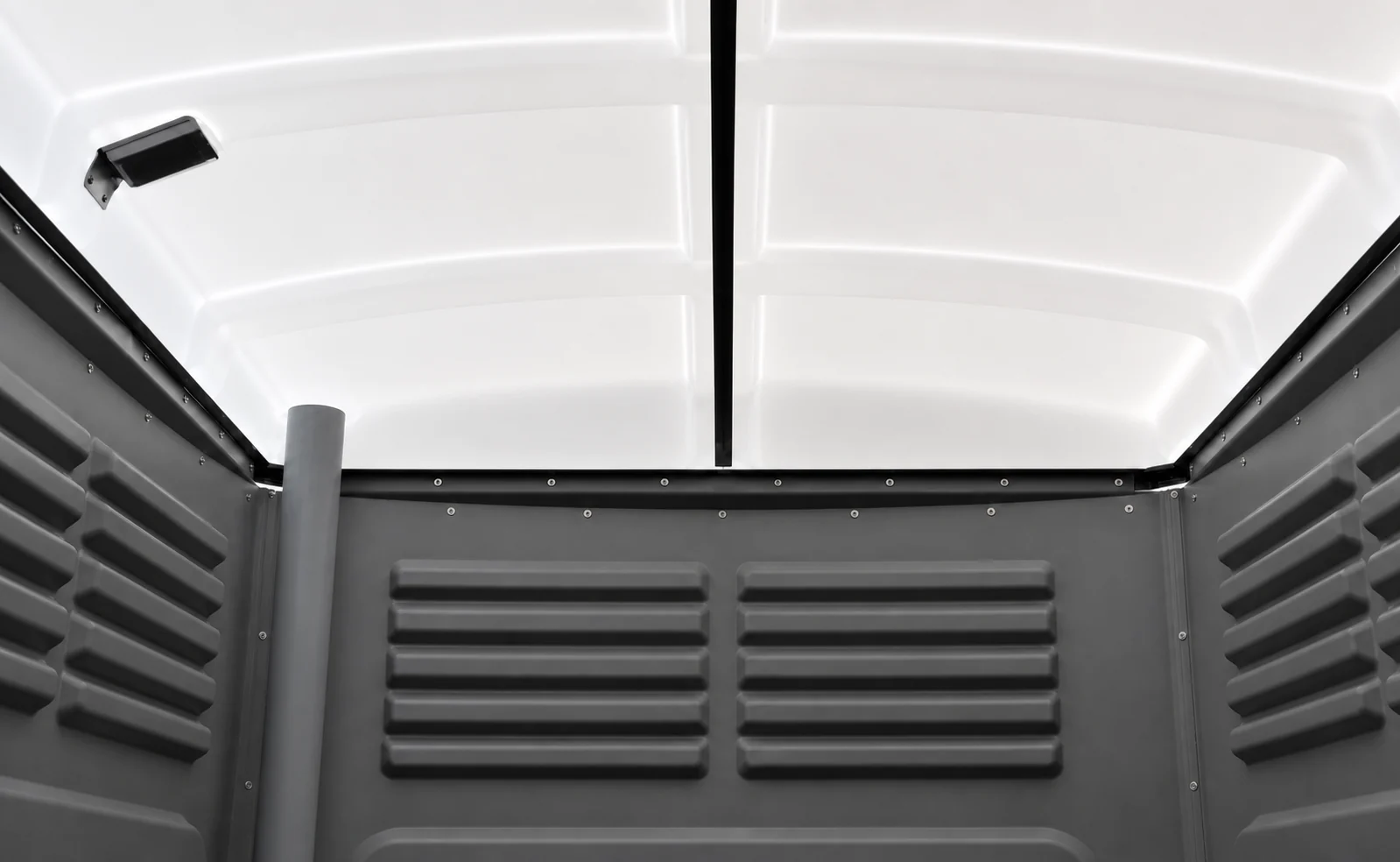 Looking up at the inside of the portaloo roof, the translucent white moulded dome that lets daylight in above the louvred wall panels